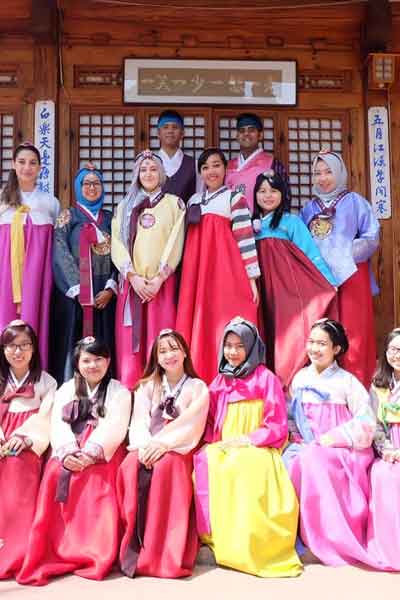 Korean women dressed in traditional Hanbok dresses at the Gyeongbokgung Palace in South Korea