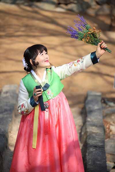 Korean woman dressed in traditional Hanbok dress in South Korea